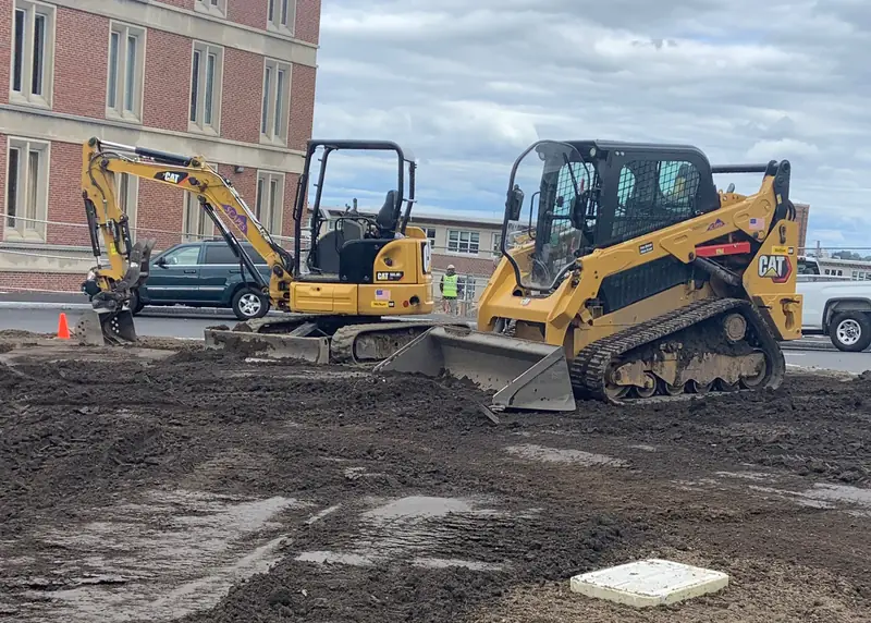 Excavator and skid steer on a site work project