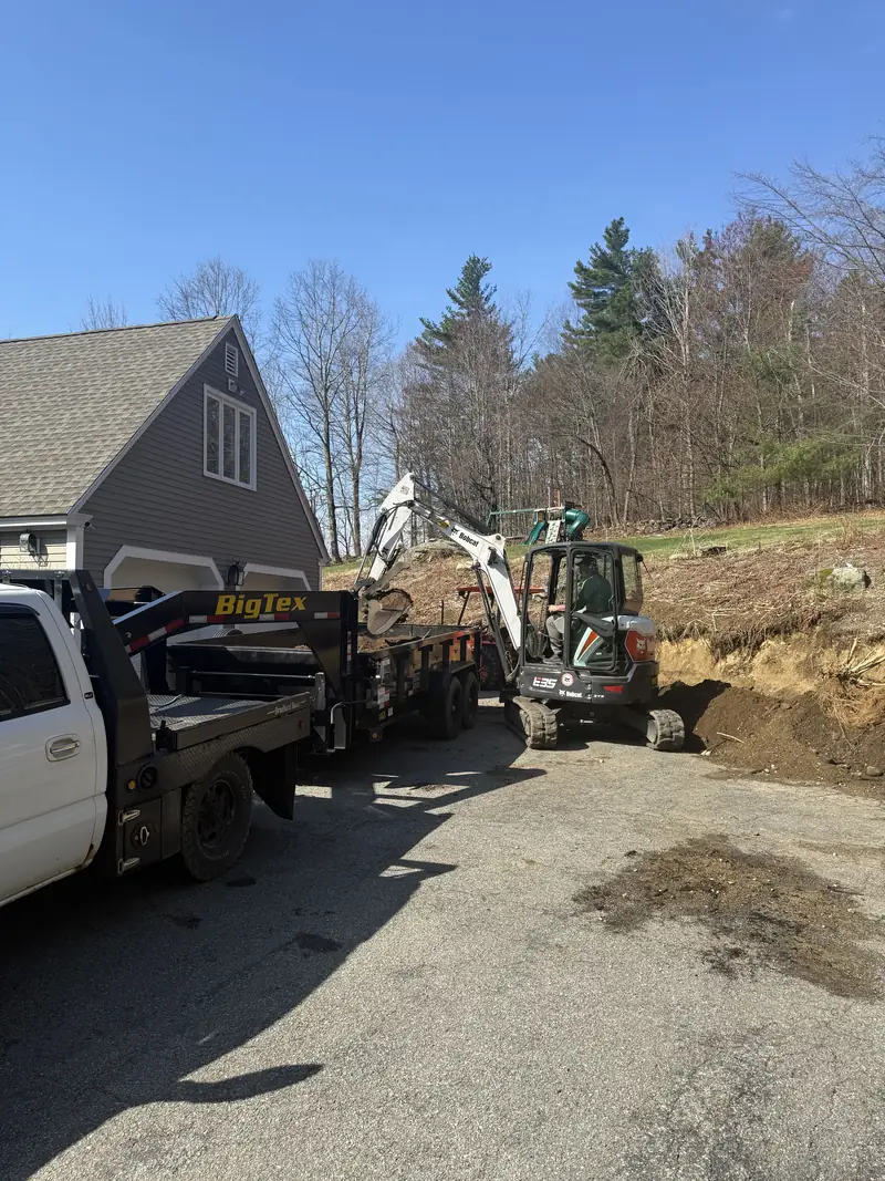 Crew and equipment on a retaining wall project
