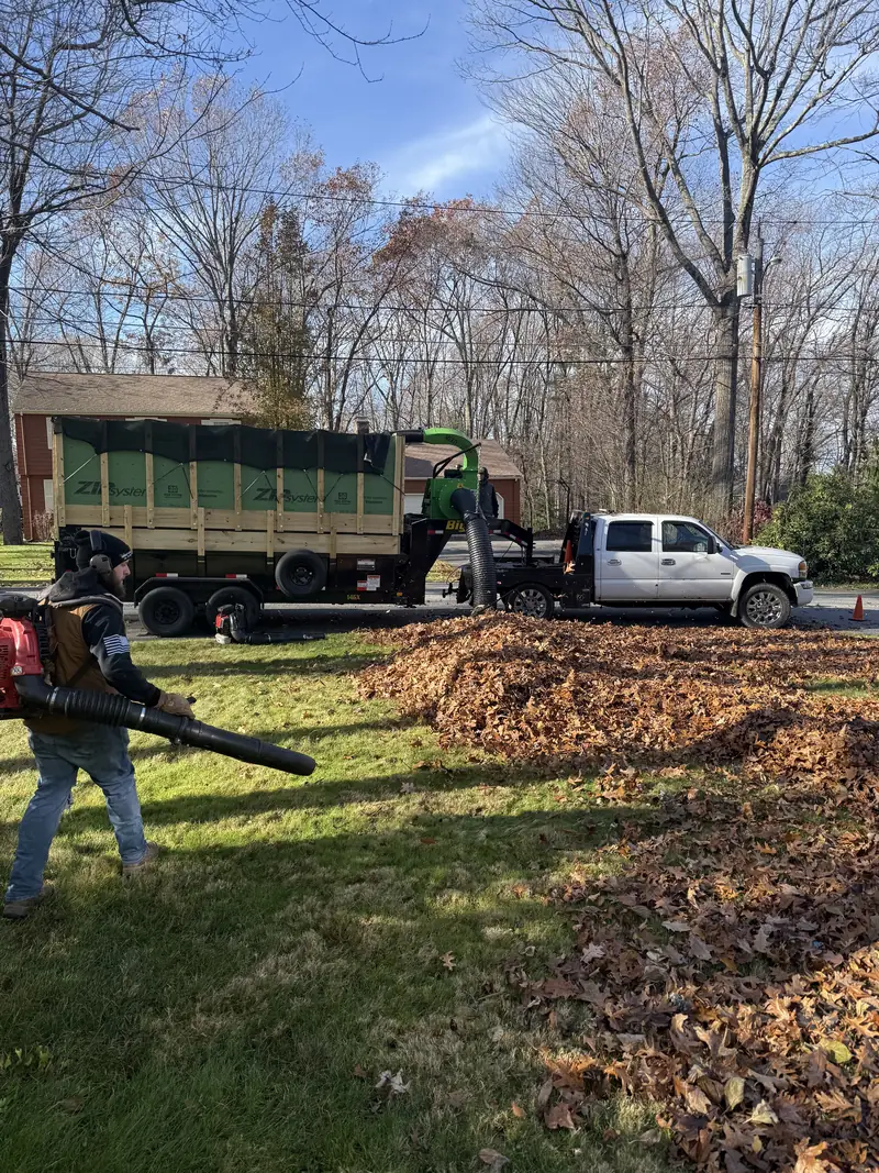Crew blowing leaves during a fall cleanup